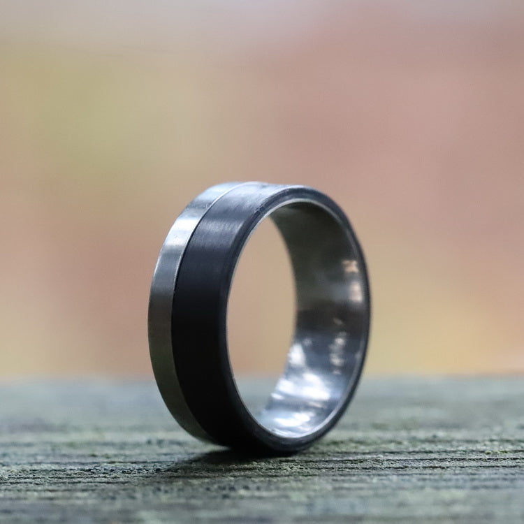 Men's Titanium Band with Carbon Fiber On A Balcony Hand Rail
